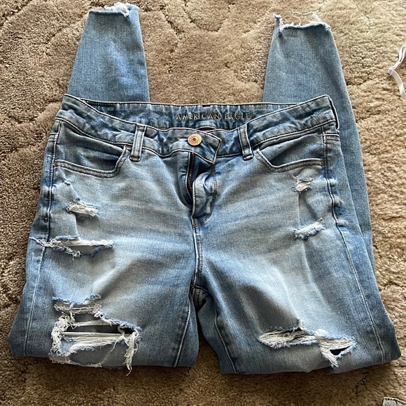 American Eagle Jeggings. Light blue in color with holes down both legs. - Picture 1 of 6